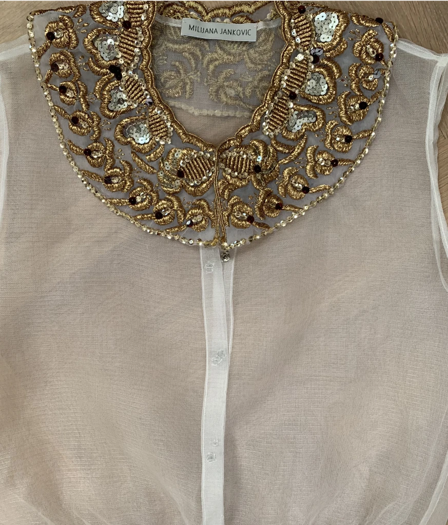 Organza top with golden collar and buttons